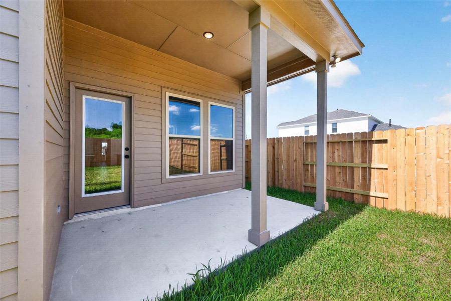 Exterior details and patio area of a home in Mostyn Springs, Magnolia (Image 21).