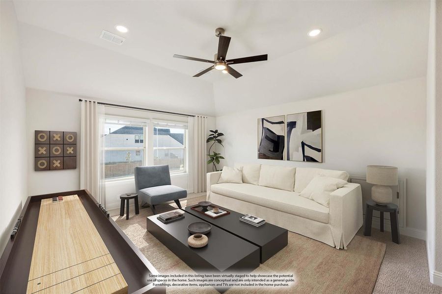 Living room with white sofa, ceiling fan, shuffleboard table, and large window with natural light Living room with white sofa, ceiling fan, shuffleboard table, and large window with natural light