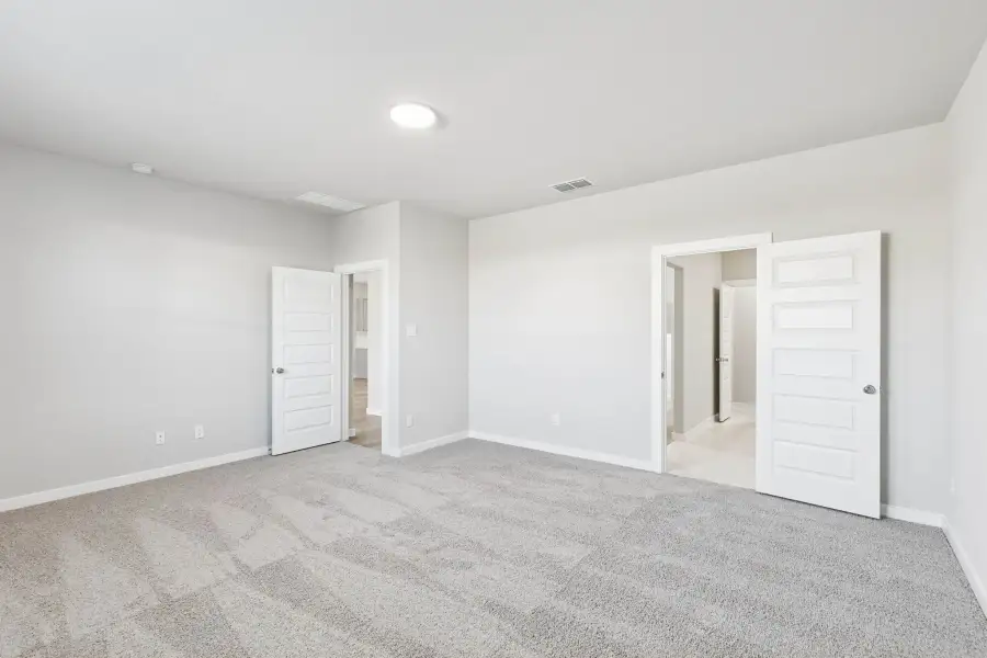 Primary Suite in the Haylee home plan by Trophy Signature Homes - REPRESENTATIVE PHOTO
