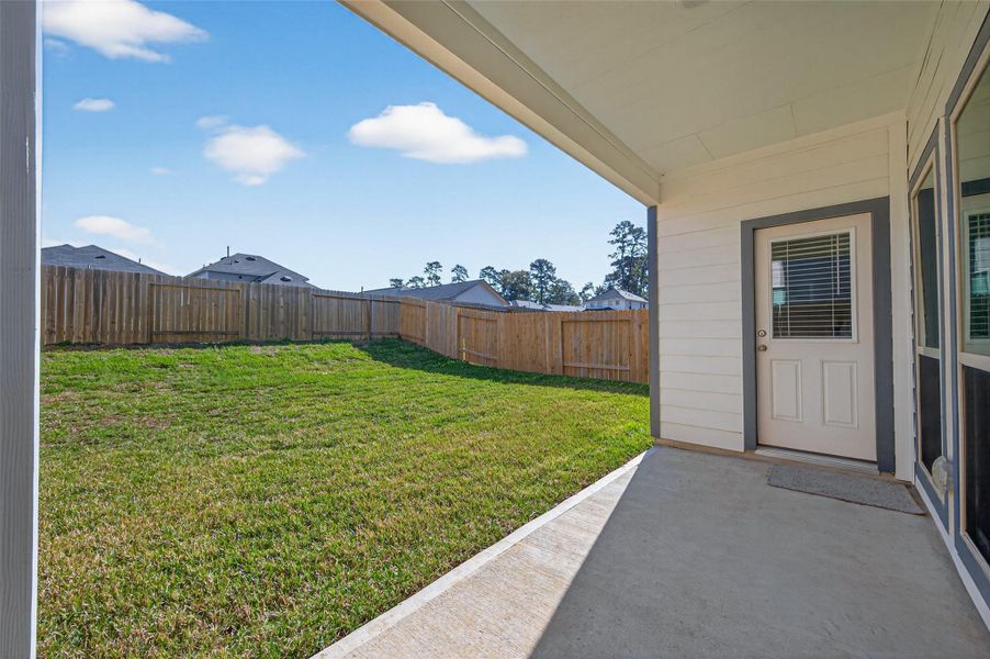 Exterior details and patio area of a home in Woodland Lakes, Huffman (Image 4). Exterior details and patio area of a home in Woodland Lakes, Huffman (Image 4).