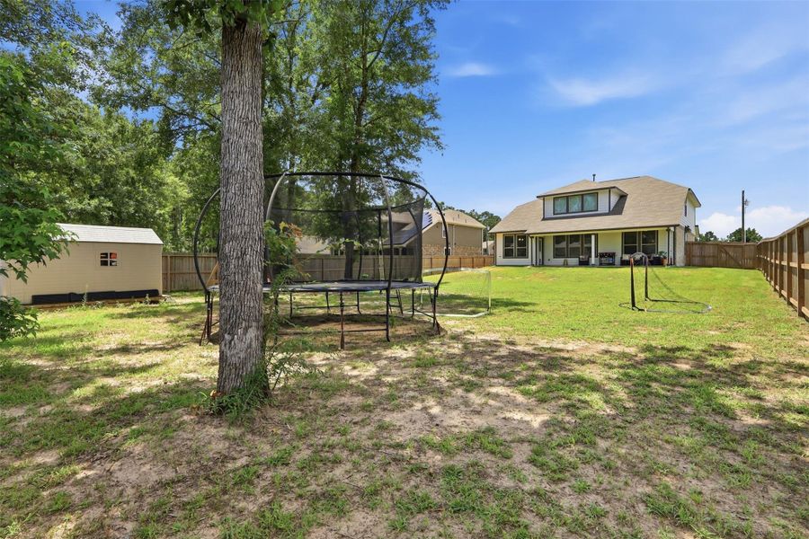 Exterior details and patio area of a home in Deer Trail Estates, Conroe (Image 26).