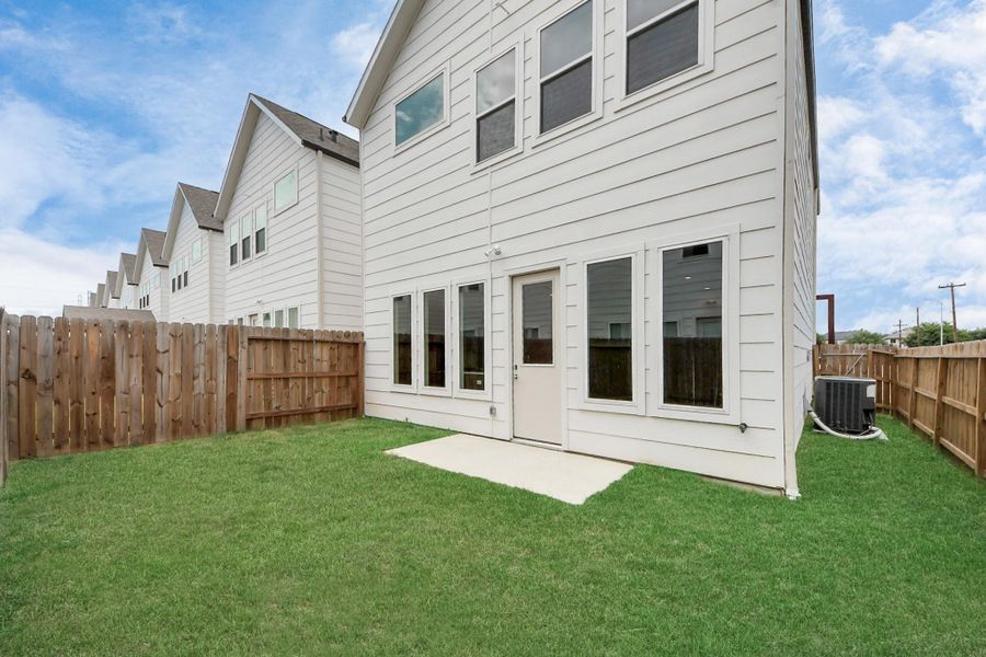 Front exterior of a new home in Agua, Houston, TX, highlighting curb appeal (Image 1).