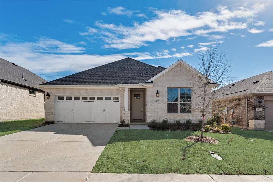 Front exterior of a new home in Villages of Hurricane Creek, Anna, TX, highlighting curb appeal (Image 21). Front exterior of a new home in Villages of Hurricane Creek, Anna, TX, highlighting curb appeal (Image 21).