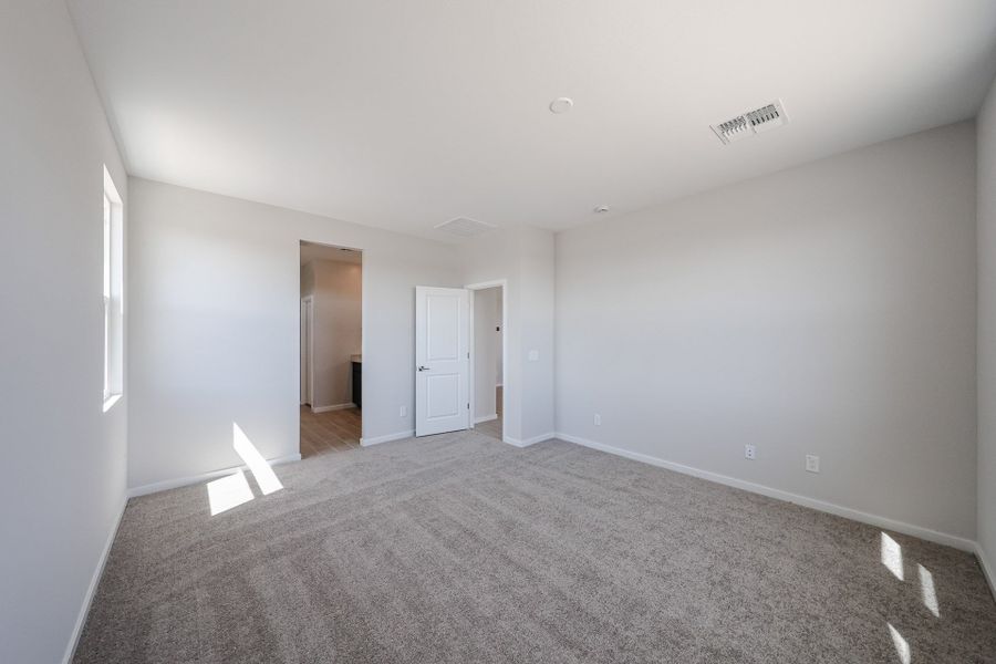 A hallway with white walls.