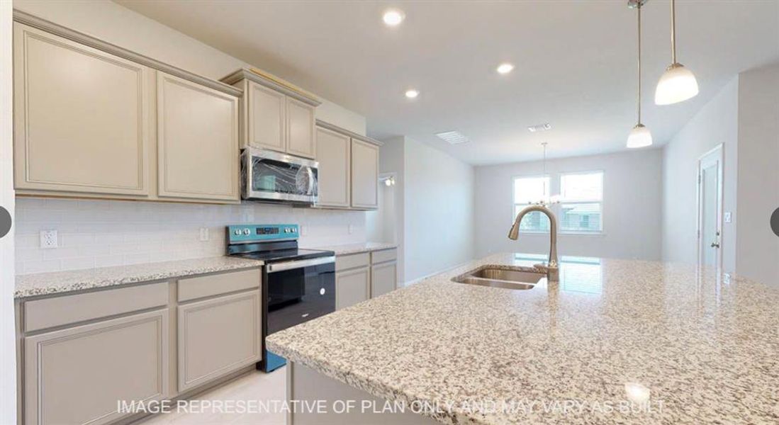 Kitchen with tasteful backsplash, stainless steel appliances, light stone counters, and a sink Kitchen with tasteful backsplash, stainless steel appliances, light stone counters, and a sink