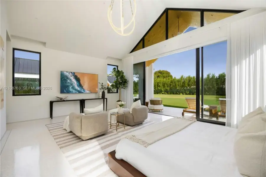 Vaulted ceilings with exposed timber detailing, expansive glass sliding walls, sleek polished flooring, and contemporary overhead lighting fixture