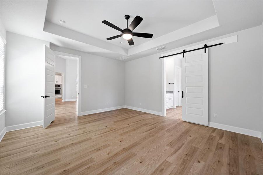 Enter to the Master bath through a beautiful, sliding barn door.