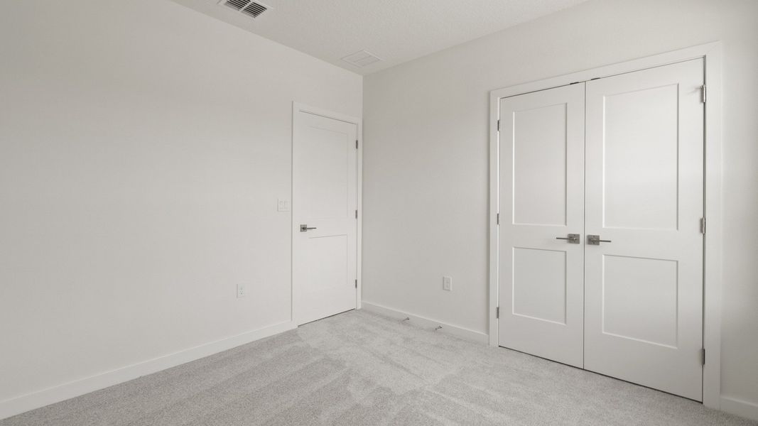 Third Bedroom and Spacious Closet in the Flagler floor plan by DRB Homes in Hamilton Bluff. Third Bedroom and Spacious Closet in the Flagler floor plan by DRB Homes in Hamilton Bluff.