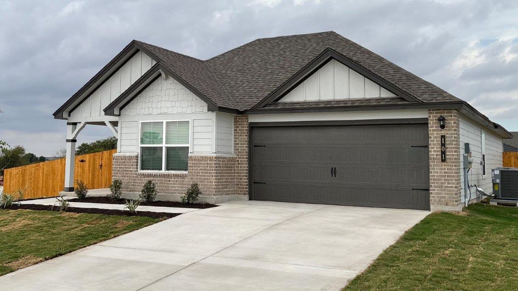 Front exterior of a new home in Eastern Wells, Jarrell, TX, highlighting curb appeal (Image 2).