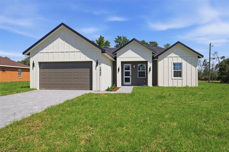Front exterior of a new home in , Ocala, FL, highlighting curb appeal (Image 20).