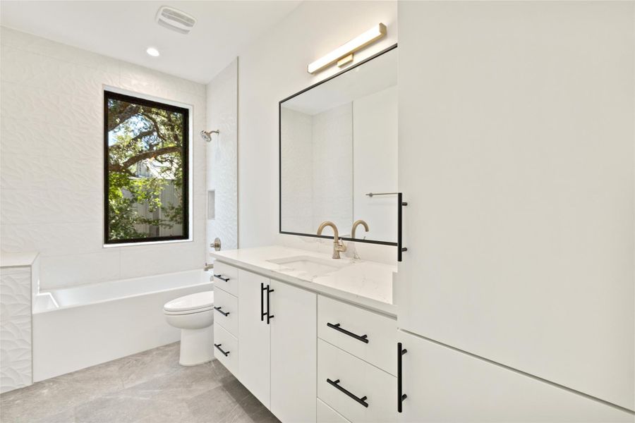 Bathroom with vanity and shower / bathtub combination