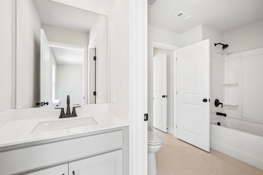 Jack and Jill bathroom featuring AW Collection® Artisan