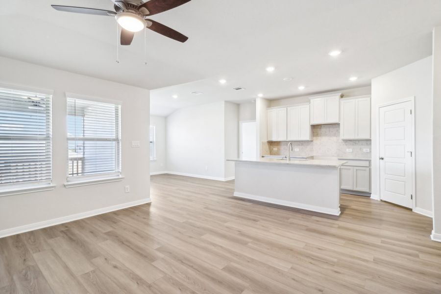 Living room and kitchen in the Briscoe floorplan at a Meritage Homes community.