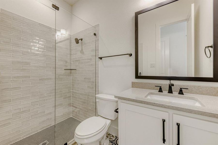 Bathroom with vanity and walk in shower