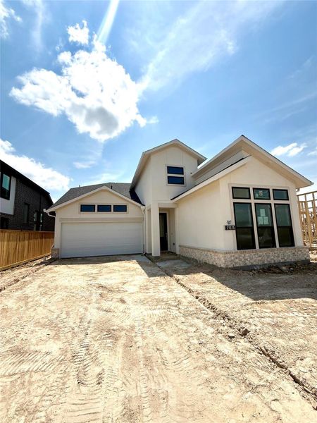 The Armstrong plan by Newmark Homes located in BRIDGELAND boasts a sleek exterior with a natural color palette. Estimated to be completed by end of September!