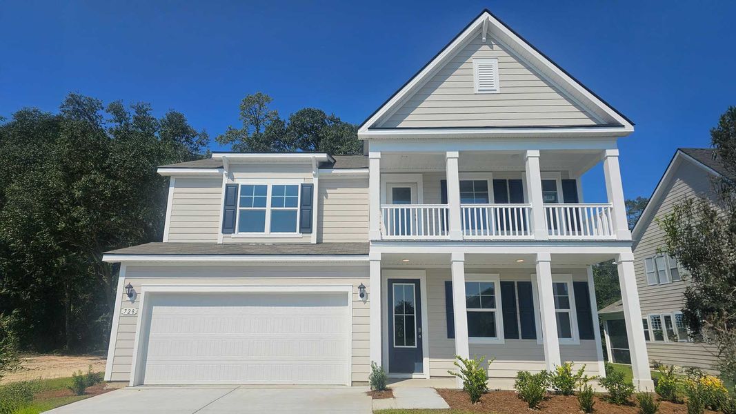 Front exterior of a new home in The Reserve at Wild Horse, Conway, SC, highlighting curb appeal (Image 1).