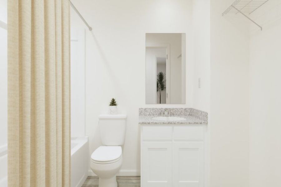 A bathroom with a sink toilet and a bathtub. A bathroom with a sink toilet and a bathtub.