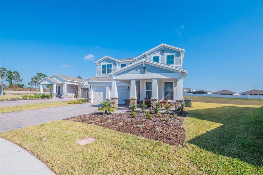 Front exterior of a new home in , Winter Garden, FL, highlighting curb appeal (Image 1). Front exterior of a new home in , Winter Garden, FL, highlighting curb appeal (Image 1).