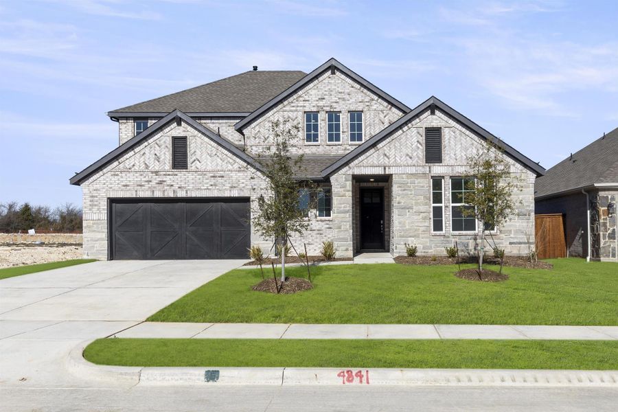 Front exterior of a home in the LaPrelle community, located in Haslet, TX (Image 22).