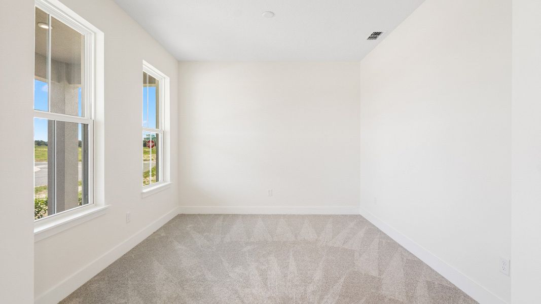 The Sweetgum front room flex space on left of entry two story home in Trailside in Mount Dora by DRB Homes