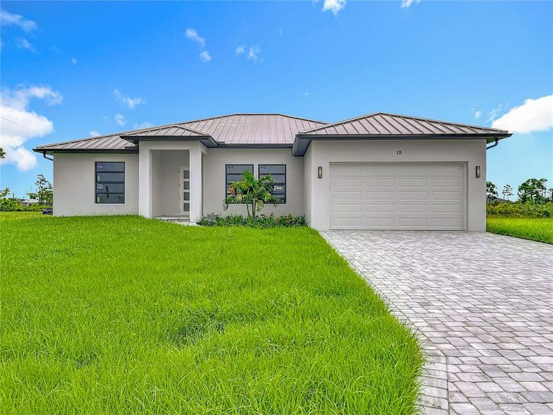 Front exterior of a new home in , Placida, FL, highlighting curb appeal (Image 30). Front exterior of a new home in , Placida, FL, highlighting curb appeal (Image 30).