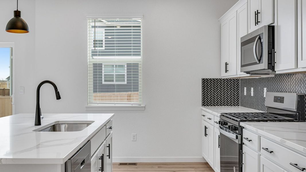 Representative furnished interior of a home built from the Bridgeport by D.R. Horton in Hansen Farm, Fort Collins (Image 7).