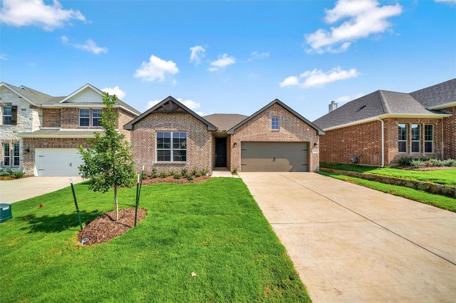 Front exterior of a new home in Liberty Pointe, Gainesville, TX, highlighting curb appeal (Image 22). Front exterior of a new home in Liberty Pointe, Gainesville, TX, highlighting curb appeal (Image 22).