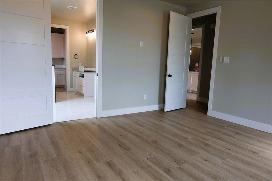 Unfurnished bedroom with light hardwood / wood-style floors