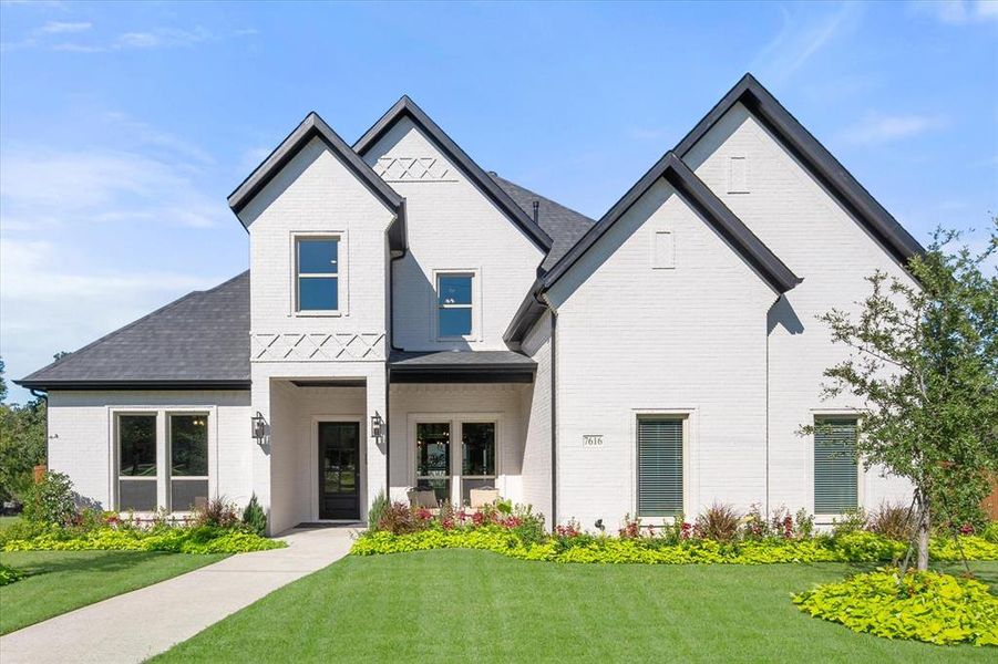 Stunning model home for sale with plush landscaping!