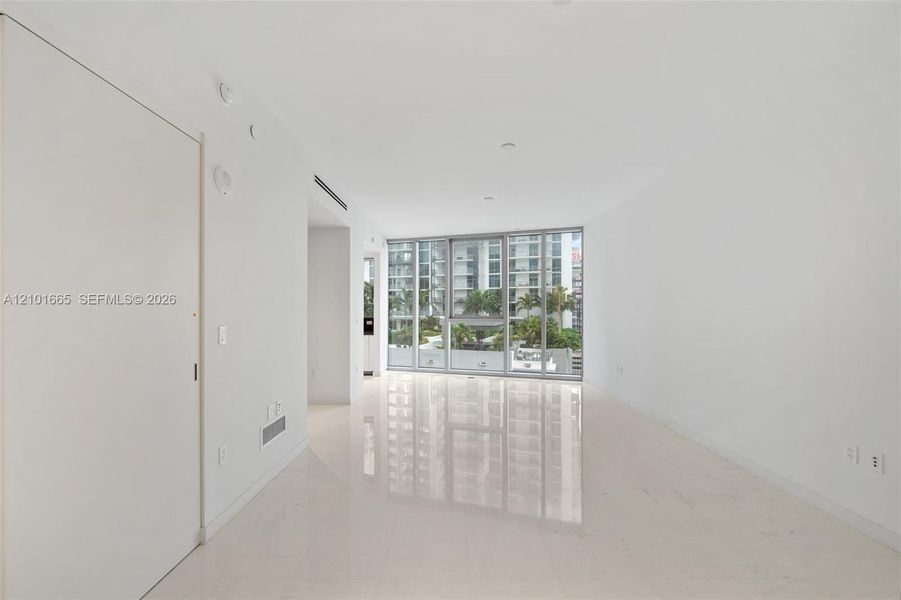 Spacious, unfurnished interior of a new home in Aston Martin Residences, Miami (Image 19).