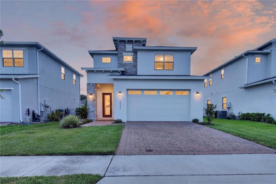 Front exterior of a new home in Twin Lakes, St. Cloud, FL, highlighting curb appeal (Image 26). Front exterior of a new home in Twin Lakes, St. Cloud, FL, highlighting curb appeal (Image 26).