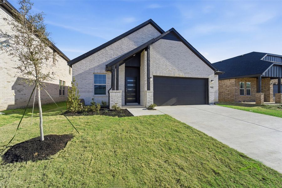 Front exterior of a new home in Sagebrook, Argyle, TX, highlighting curb appeal (Image 25). Front exterior of a new home in Sagebrook, Argyle, TX, highlighting curb appeal (Image 25).