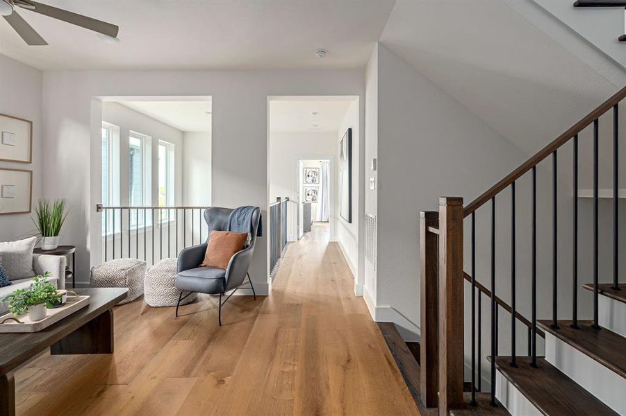 Hall with stairs and light wood-style flooring