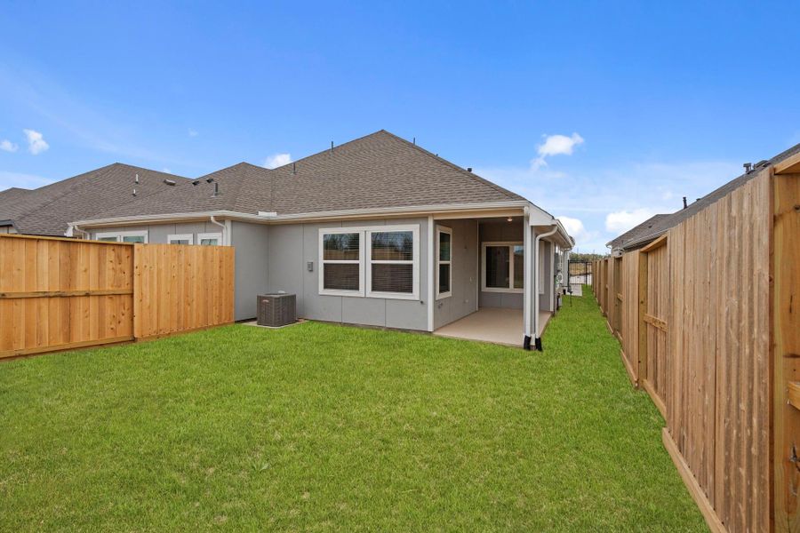 Exterior details and patio area of a home in Meridiana, Manvel (Image 3).