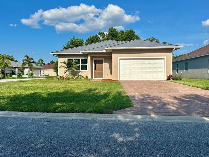 Front exterior of a new home in , Port St. Lucie, FL, highlighting curb appeal (Image 2).