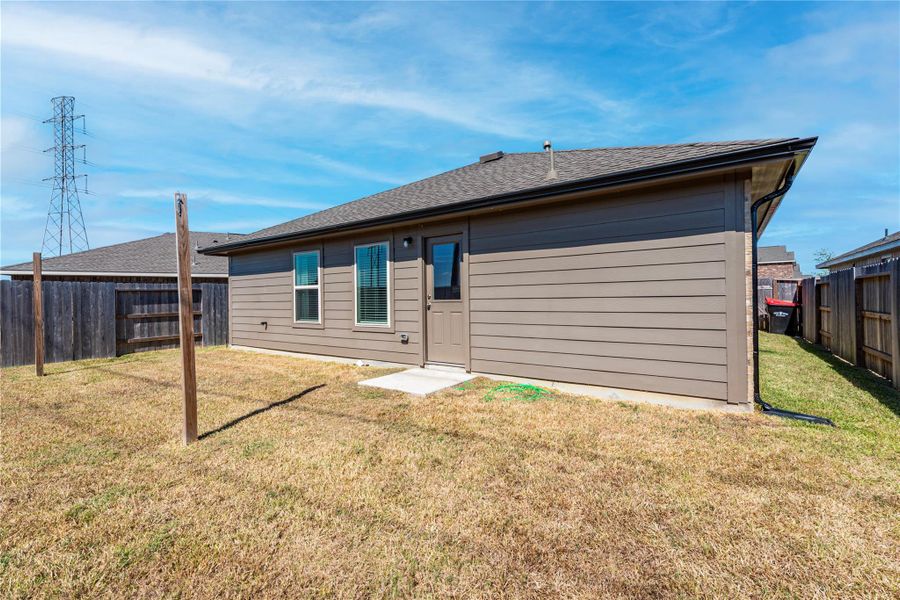 Exterior details and patio area of a home in Sterling Point at Baytown Crossings: Watermill Collection, Baytown (Image 22).