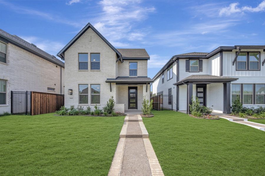 Front exterior of a new home in Karis - Cottage Series, Crowley, TX, highlighting curb appeal (Image 1). Front exterior of a new home in Karis - Cottage Series, Crowley, TX, highlighting curb appeal (Image 1).