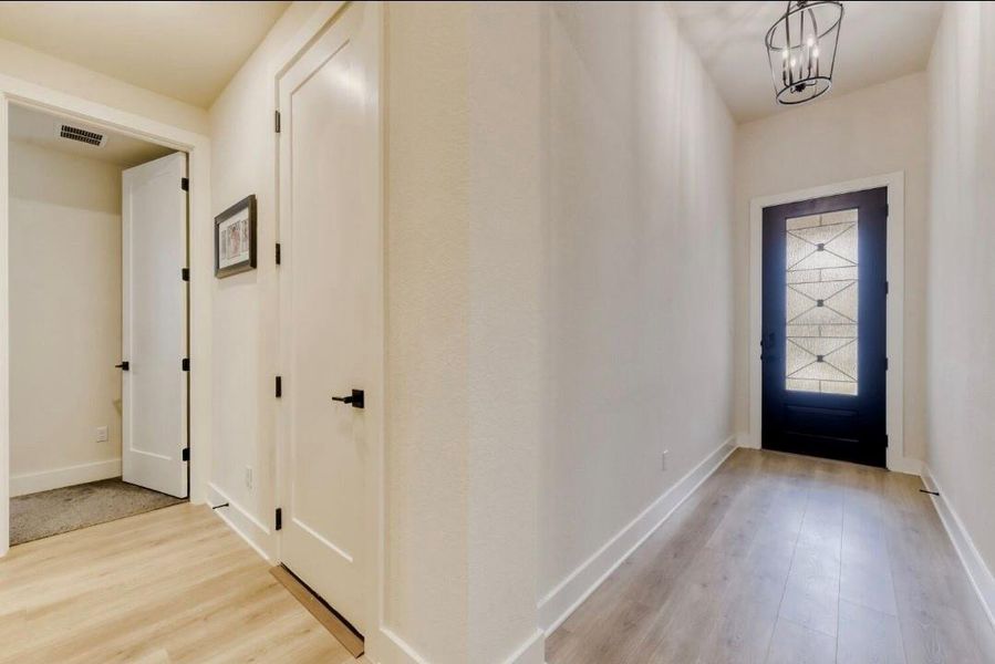 Entryway - to the left is a private guest bedroom with a full sized bathroom next to it