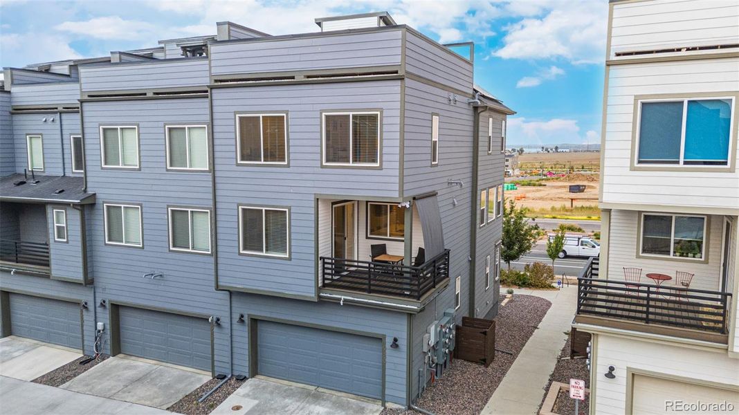 Front exterior of a new home in , Broomfield, CO, highlighting curb appeal (Image 24).