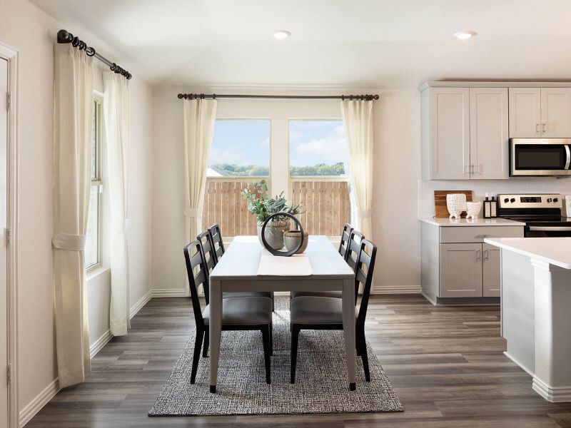 Beautiful natural lighting makes the dining area feel light and airy.