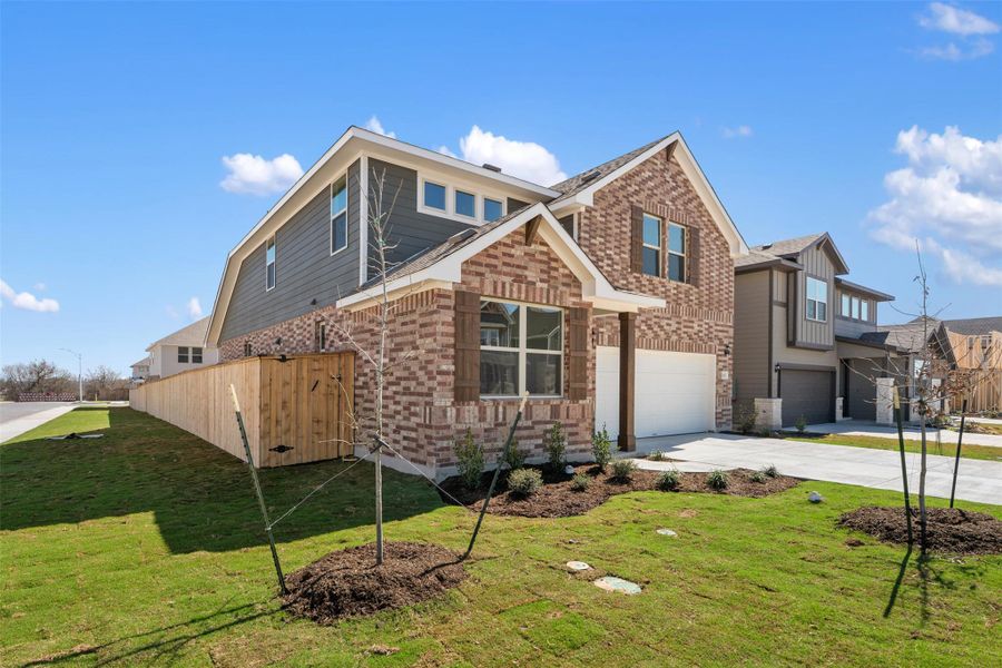 Front exterior of a new home in Patterson Ranch, Georgetown, TX, highlighting curb appeal (Image 24).