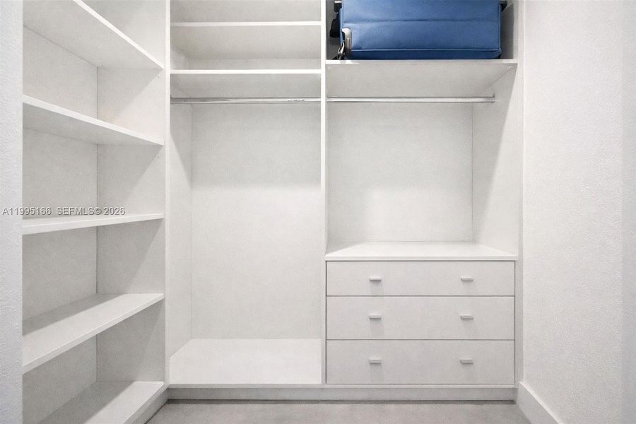Custom-designed closet maximizing storage and organization Custom-designed closet maximizing storage and organization