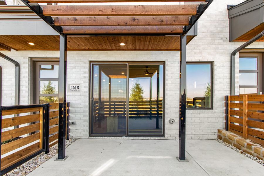 Exterior details and patio area of a home in Wildridge, Oak Point (Image 27).
