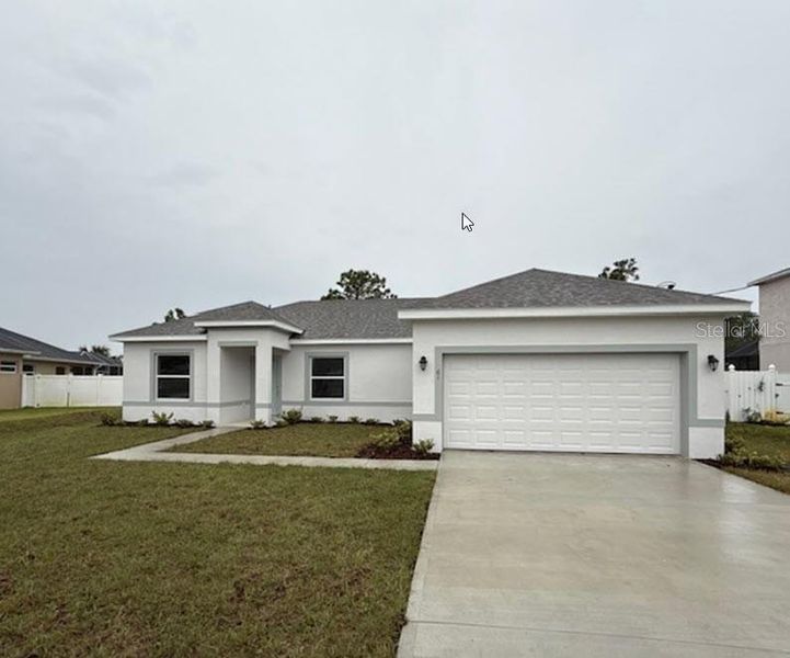 Front exterior of a new home in Palm Coast: Cornerstone Collection, Palm Coast, FL, highlighting curb appeal (Image 1).