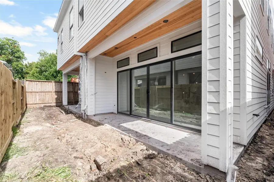 Covered patio and fully fenced in backyard.