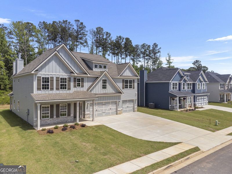 Front exterior of a new home in Juliette Crossing, Forsyth, GA, highlighting curb appeal (Image 29).