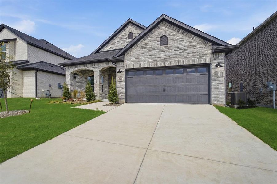 Front exterior of a new home in Westridge, McKinney, TX, highlighting curb appeal (Image 2).
