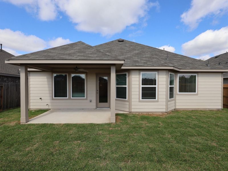 Exterior details and patio area of a home in Pinewood at Grand Texas, New Caney (Image 3). Exterior details and patio area of a home in Pinewood at Grand Texas, New Caney (Image 3).