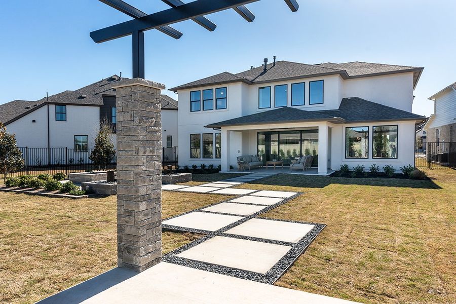 Representative exterior photo of a completed home built from the Ametrine by Taylor Morrison in Parkside on the River 60s, Georgetown, TX (Image 24).