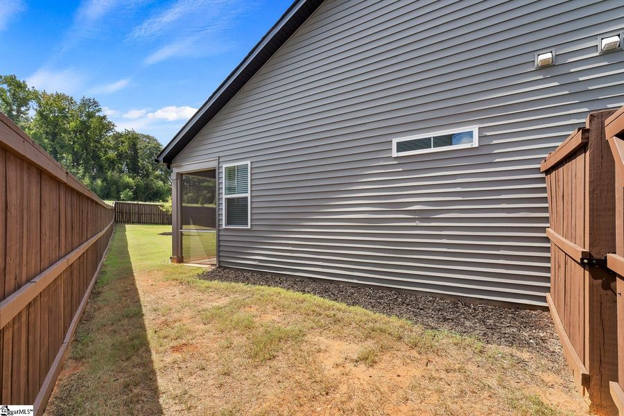 Exterior details and patio area of a home in Saratoga Oaks, Williamston (Image 23).